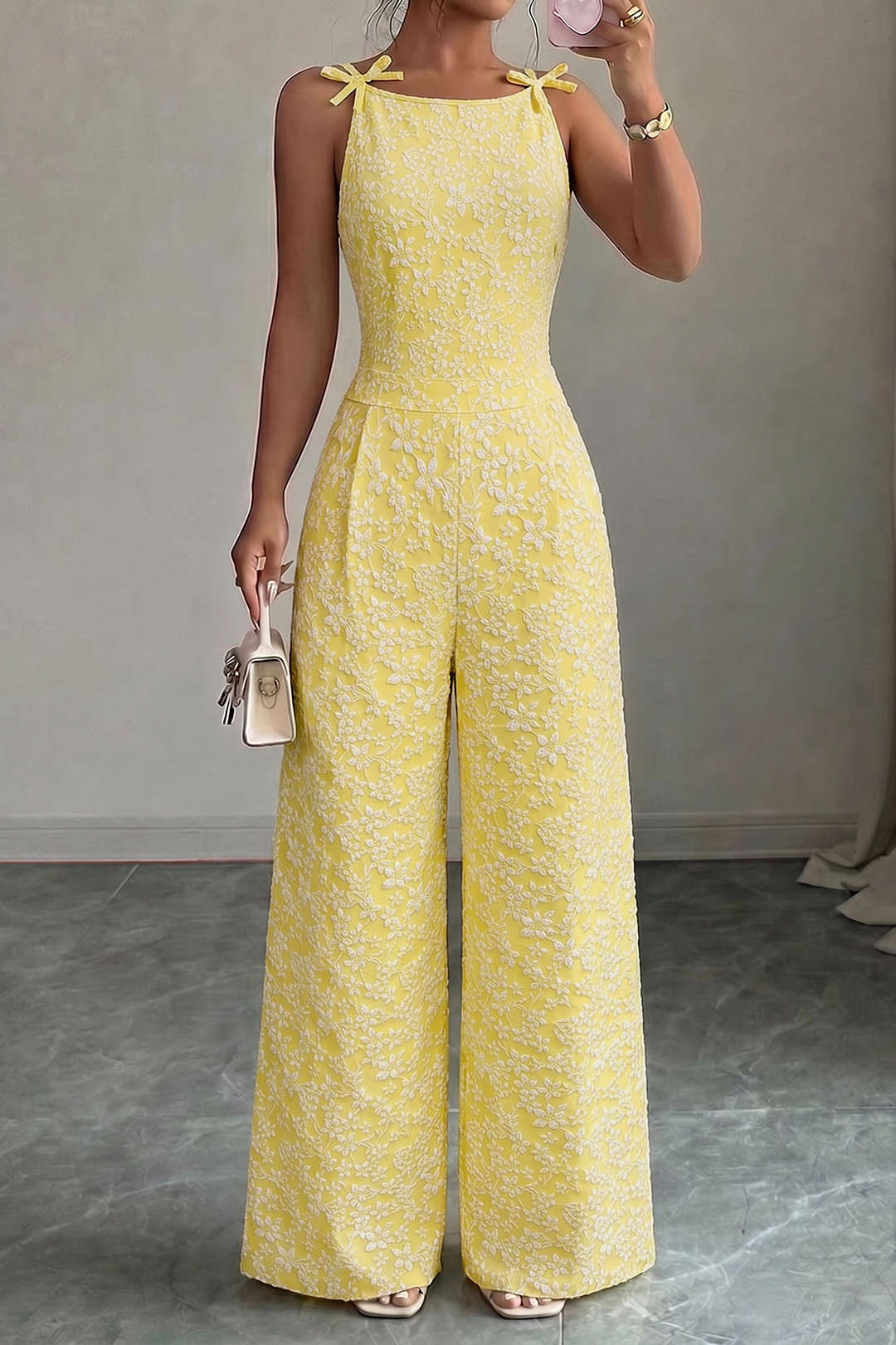 Gestructureerde mouwloze jumpsuit met ronde hals en strik
