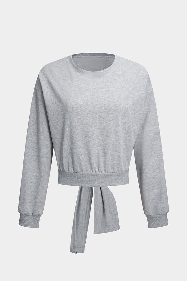 Top met uitsnijding, open rug en lange mouwen