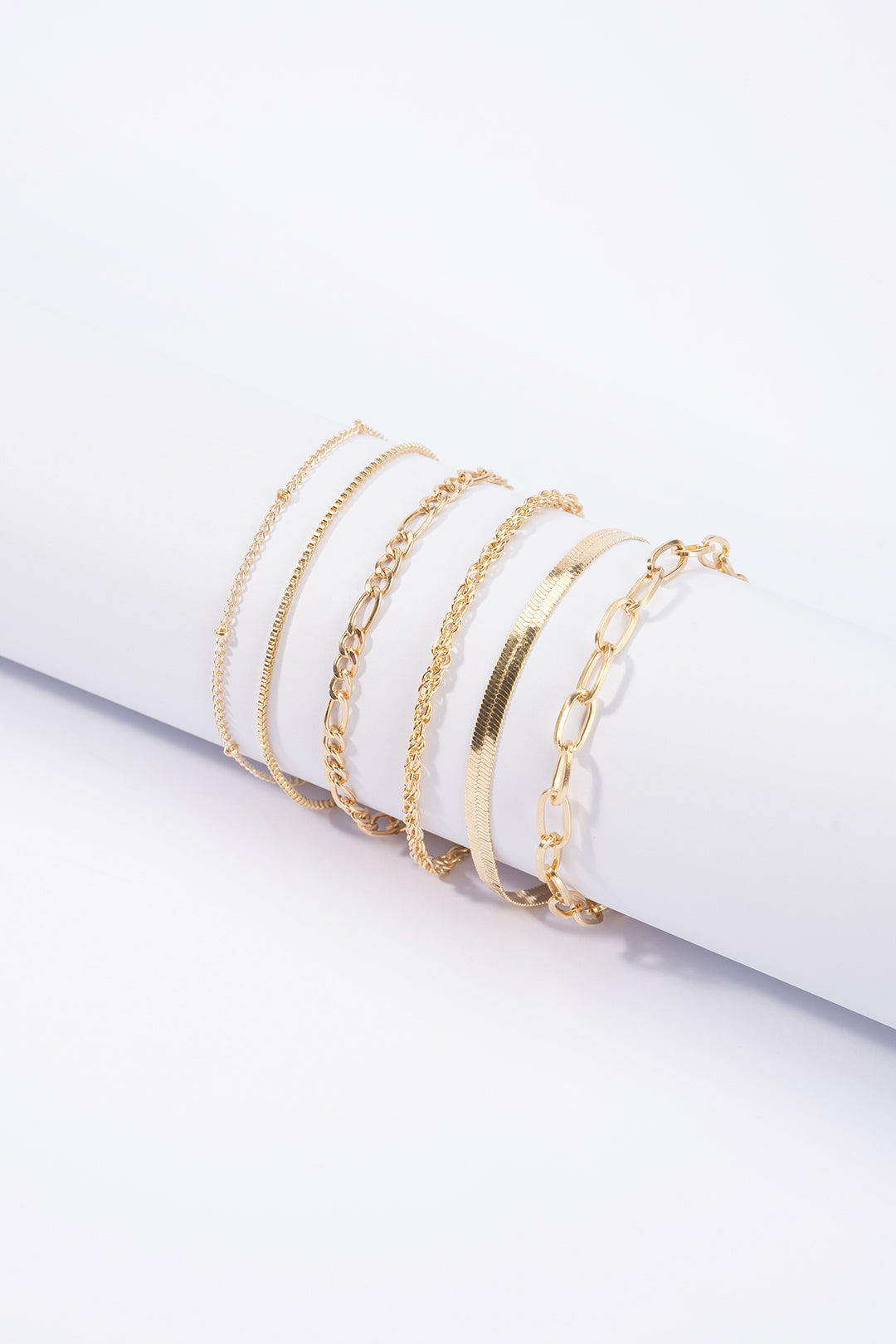 Geometrische armbanden met kettingdetail