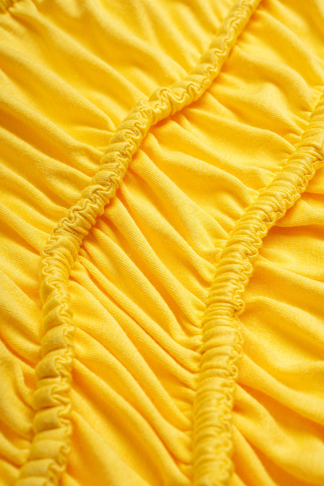 Asymmetrische tanktop met ronde hals, trekkoord en ruches