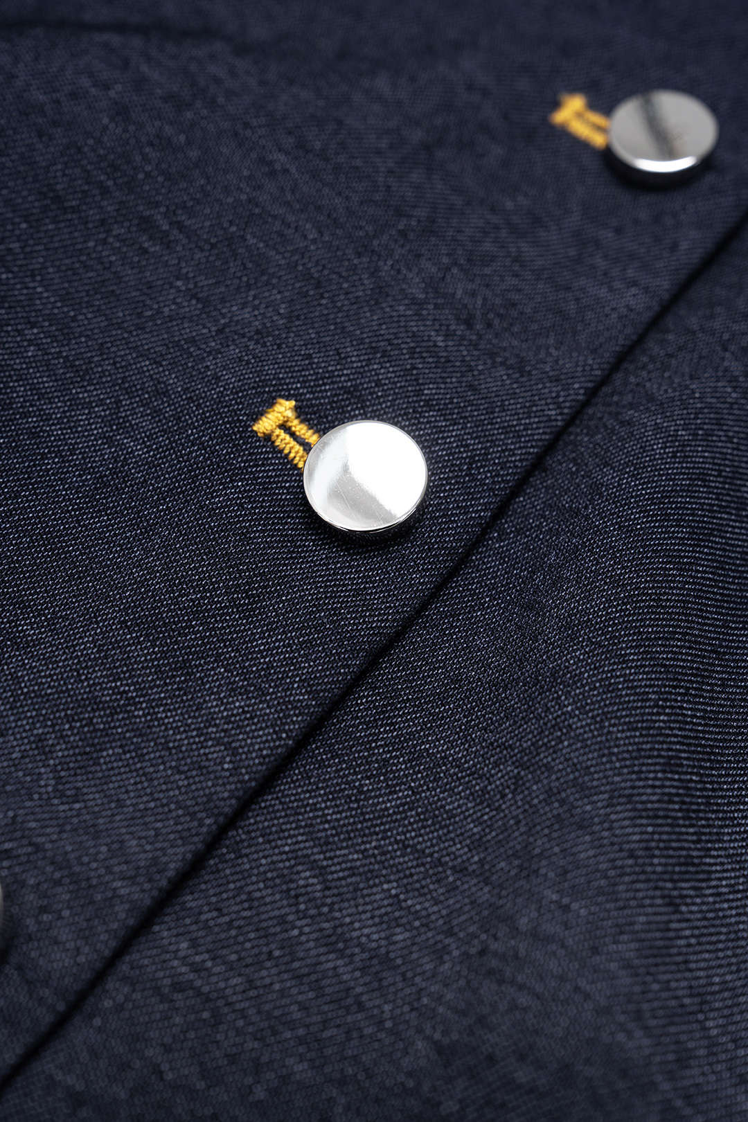 Denim body met strik en knoopjes