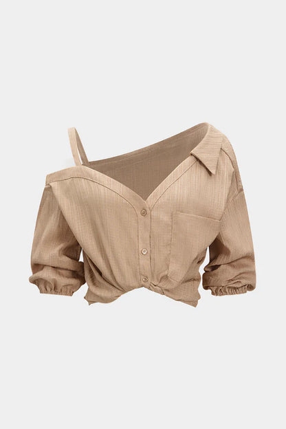 Asymmetrische mouwloze blouse met knoopsluiting en open rug