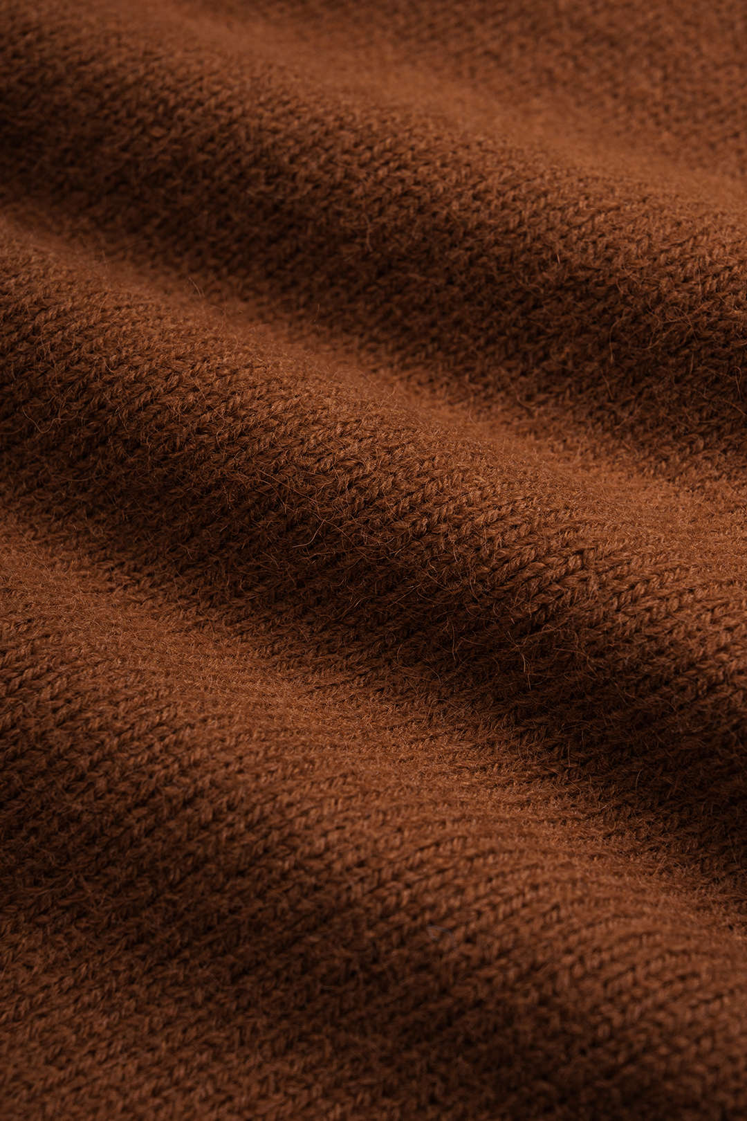Gebreide metallic top met knoopjes en knoopdetail