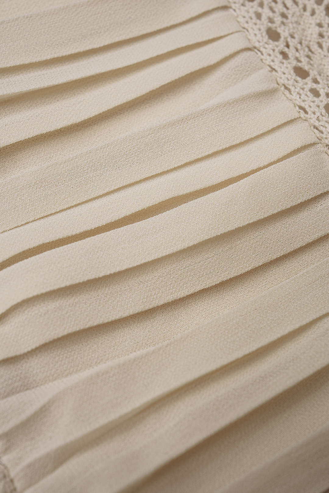 Chiffon asymmetrische top met V-hals en strik