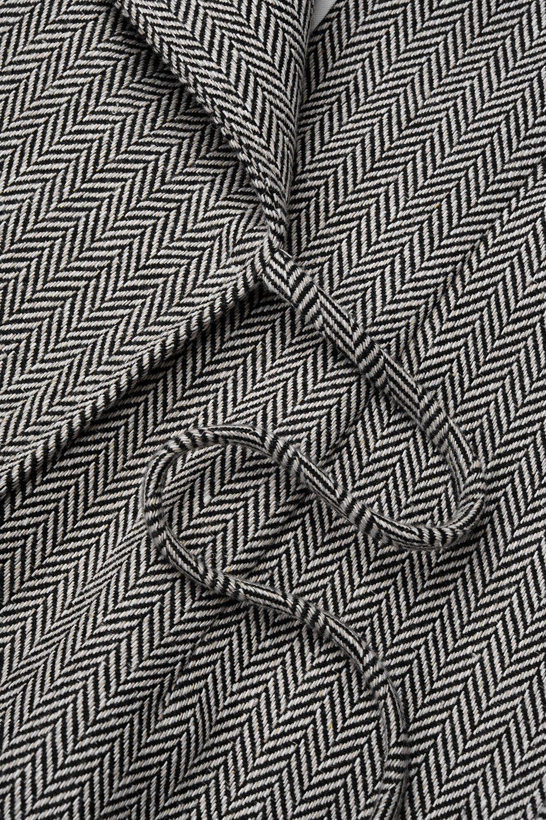 Geometrische patchwork minijurk met strik en lange mouwen