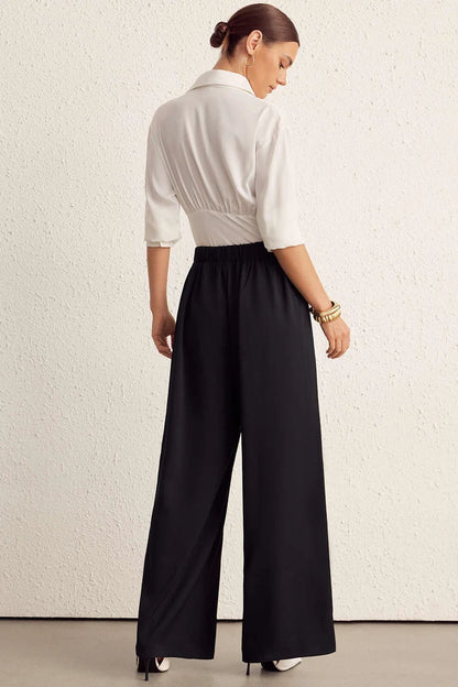 Solid trousers with a belt and wide legs