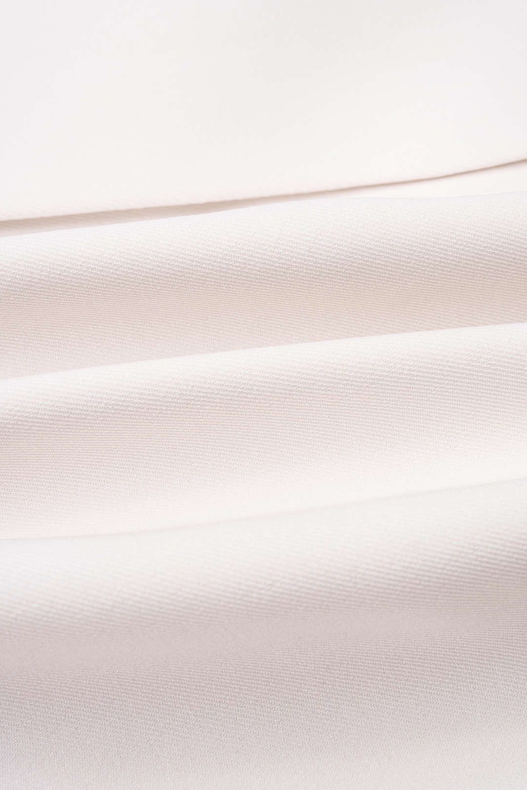Metallic mouwloze minijurk met halternek en V-hals